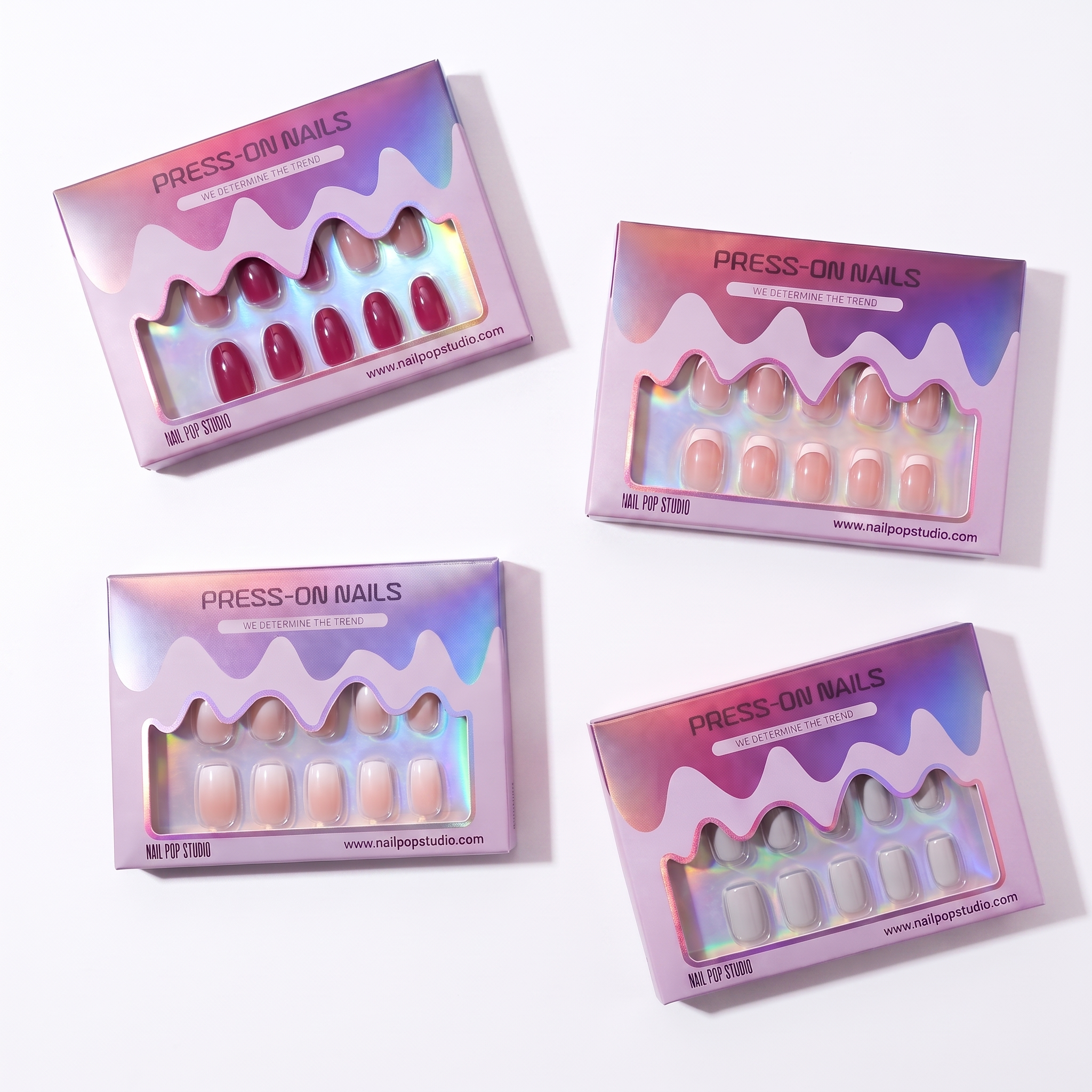 Press-on nails set in iridescent pink and purple packaging, glossy faux nail tips
